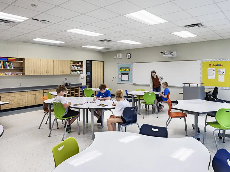 Classroom with children coloring with markers