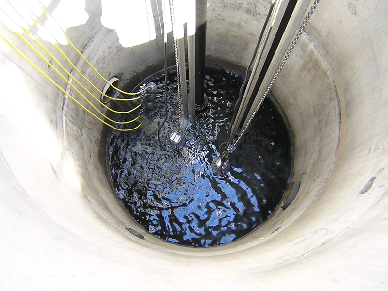 Wastewater treatment plant basin filled with water.