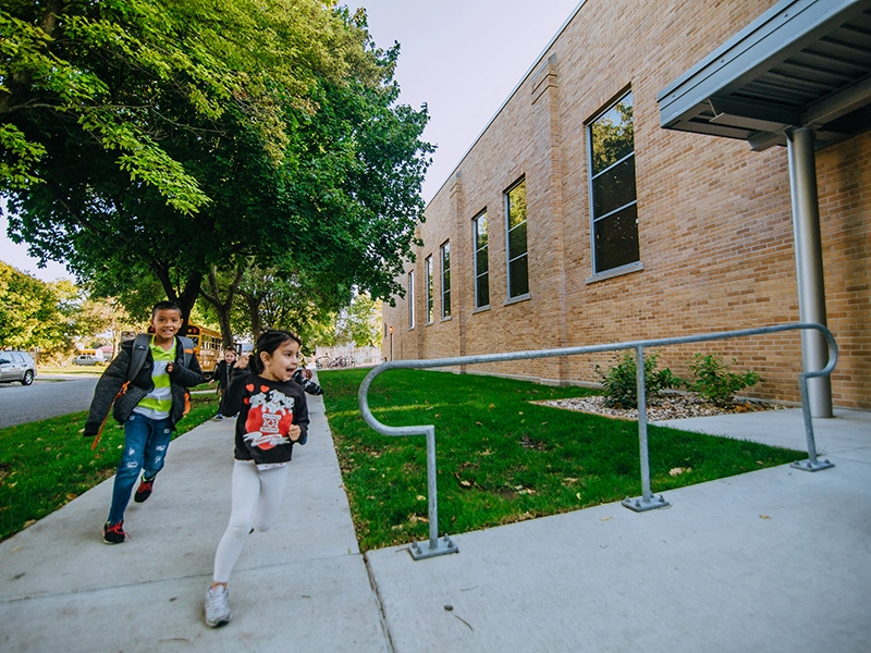 Kids Running into Pocahontas Area Schools Elementary after Renovation