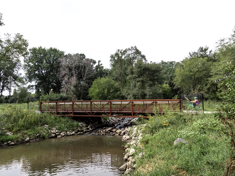 Pedestrian trail bridge over creek