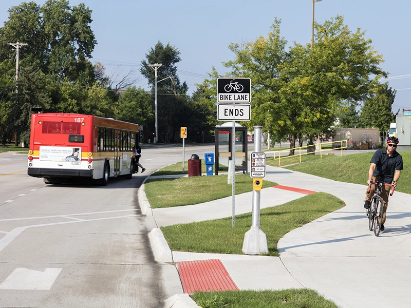 Bus stop and biking pedestrian