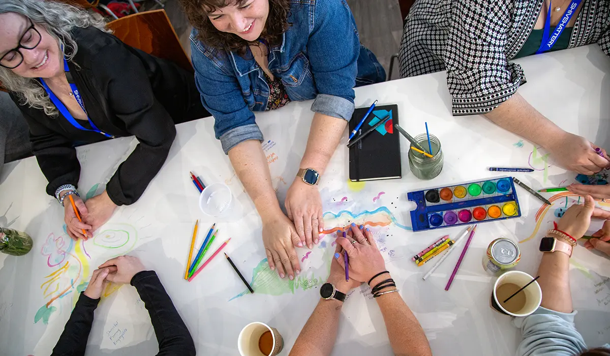 Group art activity with architects working in watercolors