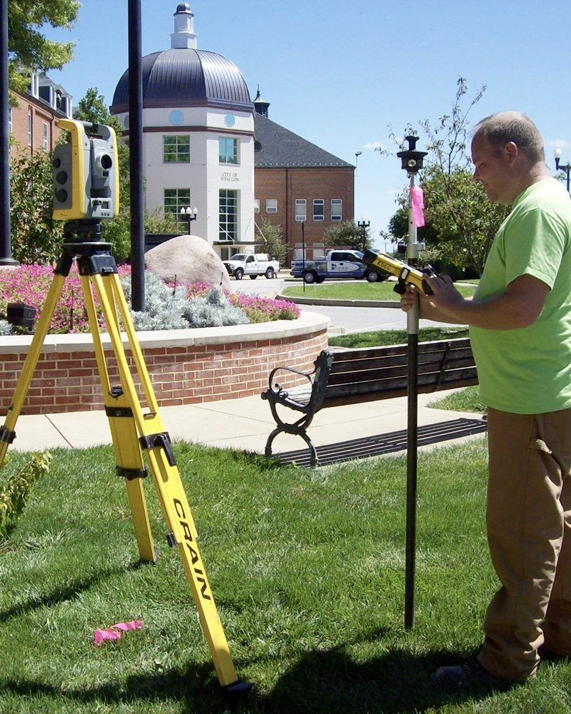 Man working with surveying equipment