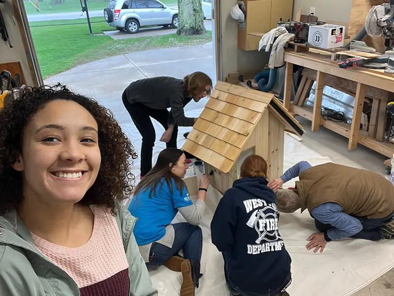 Selfie and group photo of building the Valparaiso Little Free Library