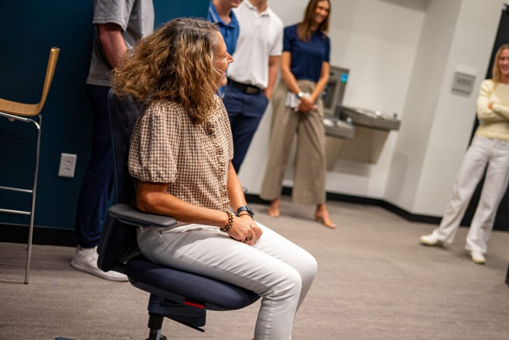 A Shive-Hattery coworker sits in the KI chair during the Quad Cities demo