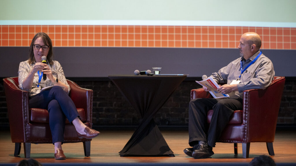 Two Shive-Hattery leaders in conversation on stage during an educational session at the 2026 Corporate Swarm