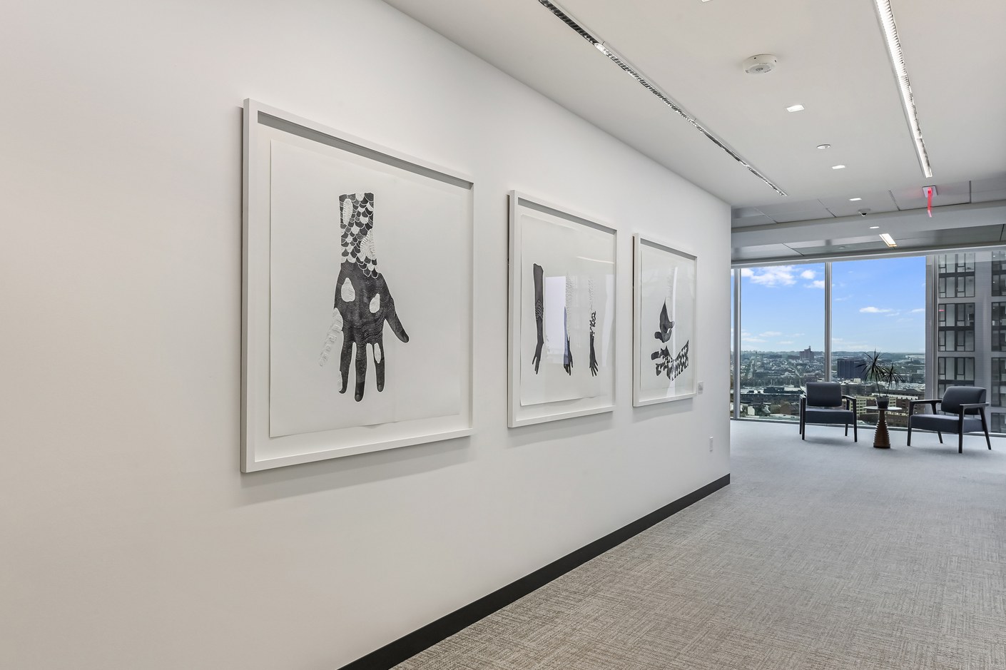 Renovated office corridor with artwork leading to a window lounge